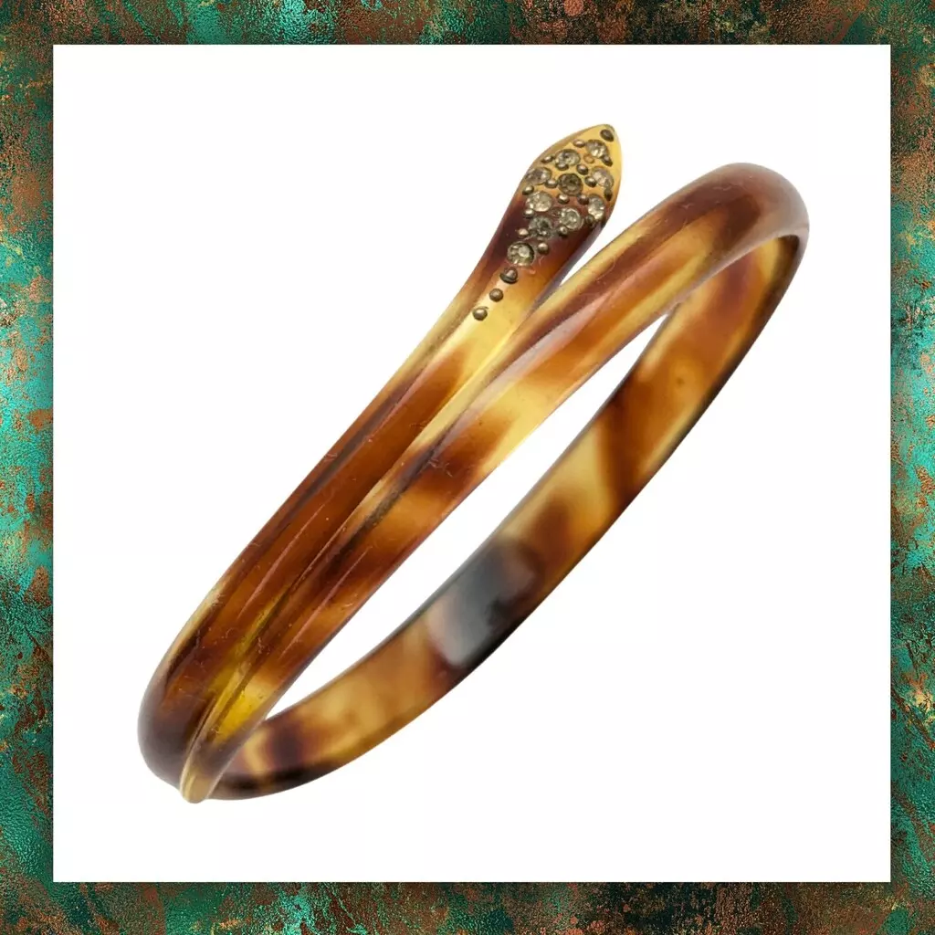 Vintage plastic snake bangle with rhinestone eyes